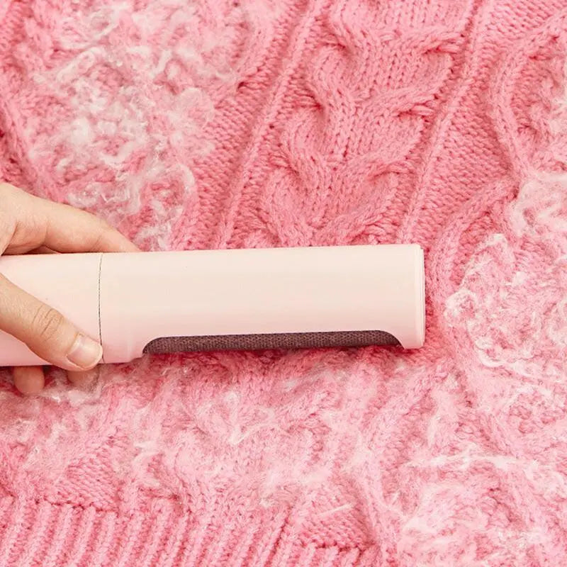 Reusable pet hair remover brush in use